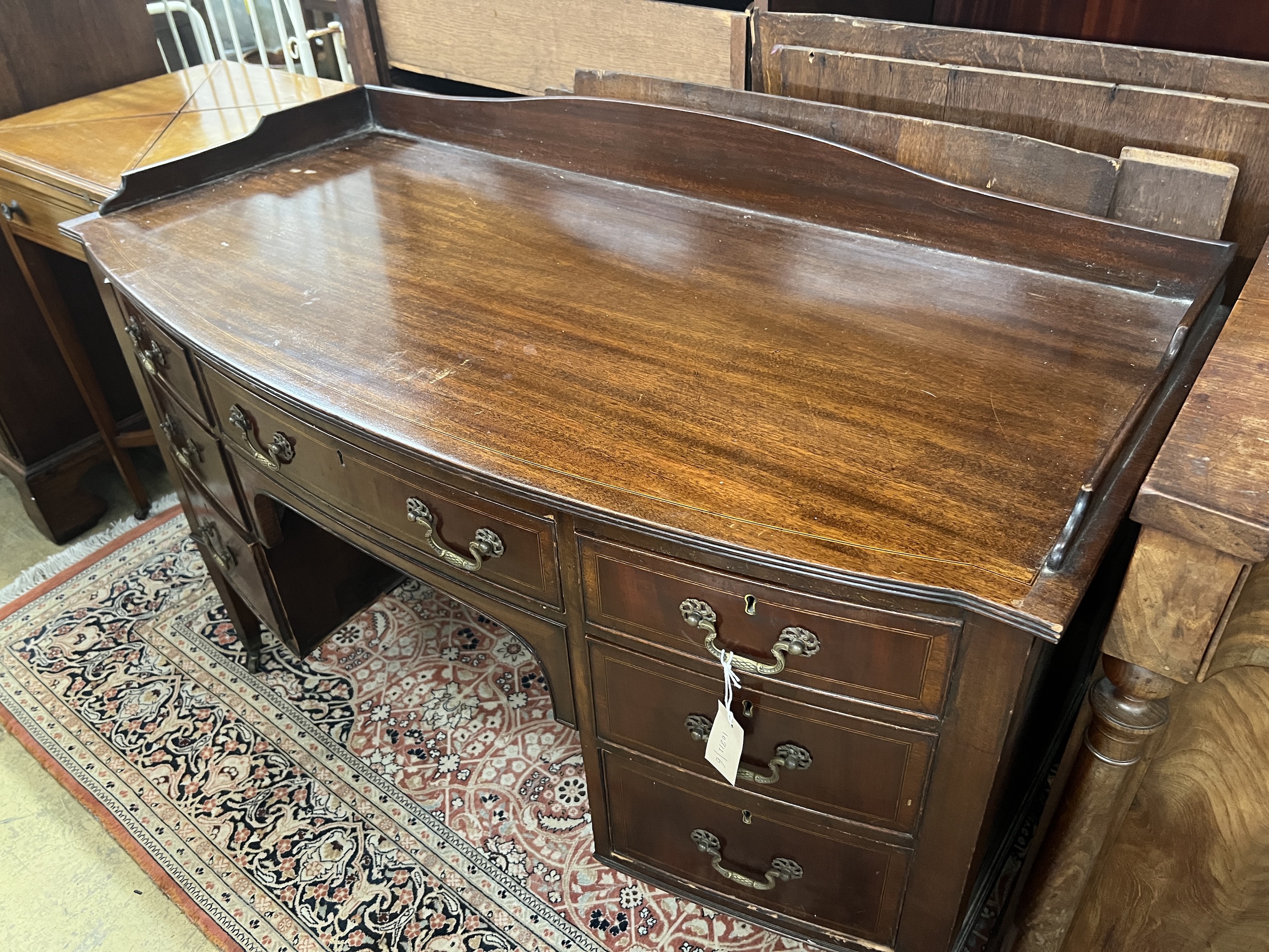 An Edwardian mahogany bow front kneehole washstand, width 122cm, depth 58cm, height 86cm